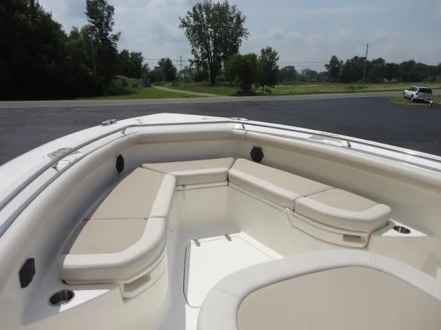 Slide: The Image of 2021 Boston Whaler 350 Outrage boat with spacious seating area and sleek design. - 18