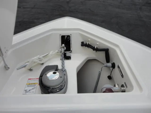 Slide: The Image of 2021 Boston Whaler 350 Outrage anchor compartment with chain and rope storage. - 21