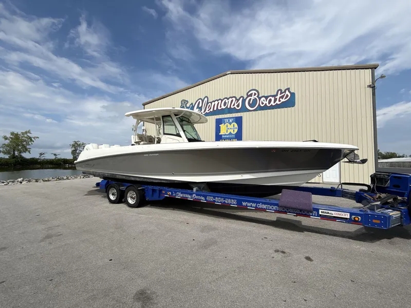 Slide: The Image of 2021 Boston Whaler 350 Outrage on trailer at Clemons Boats dealership. - 3