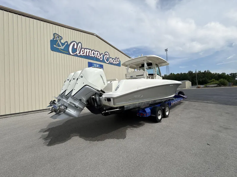 Slide: The Image of 2021 Boston Whaler 350 Outrage boat on trailer at Clemons Boats dealership. - 6