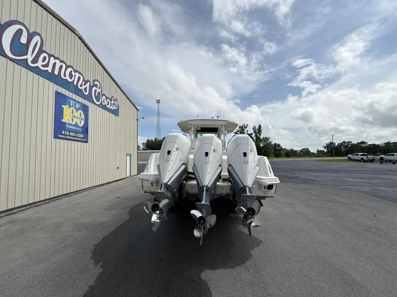Slide: The Image of 2021 Boston Whaler 350 Outrage with triple engines at Clemons Boats dealership. - 7