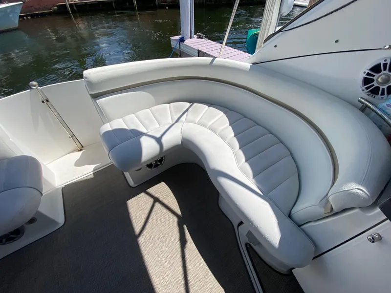 Slide: The Image of Curved white seating on 2006 Doral 365 boat, dockside view. - 25