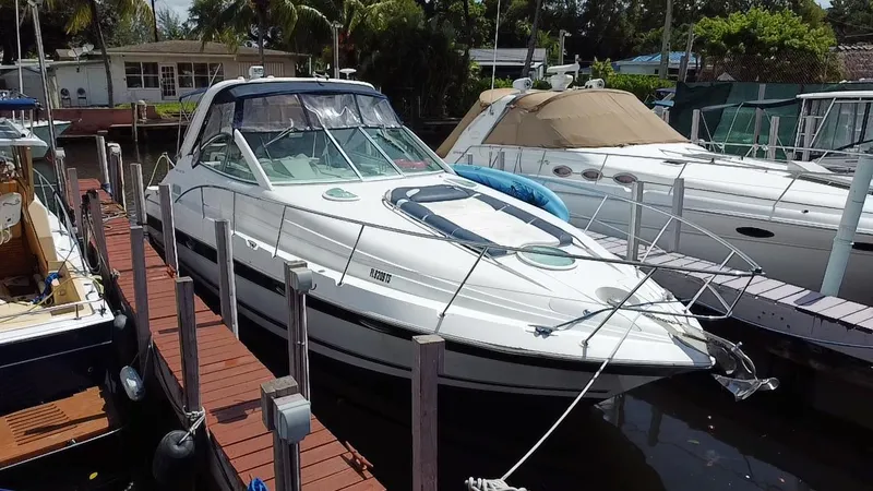 Slide: The Image of 2006 Doral 365 boat docked at marina, surrounded by other vessels. - 3