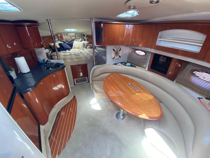 Slide: The Image of Luxurious interior of a 2006 Doral 365 yacht with wood finishes and cozy seating. - 33