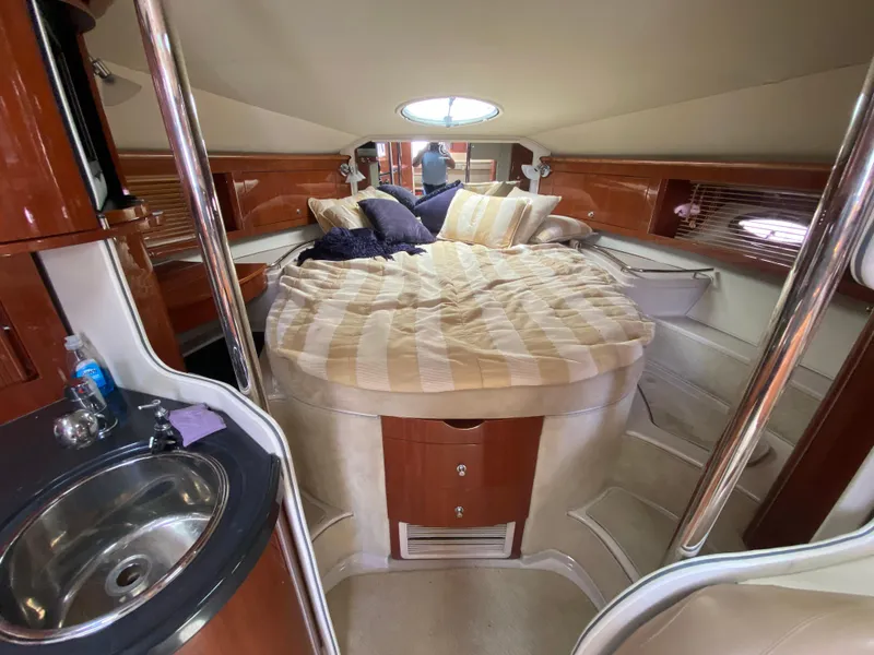 Slide: The Image of Luxurious interior of a 2006 Doral 365 yacht with cozy bed and sink. - 36