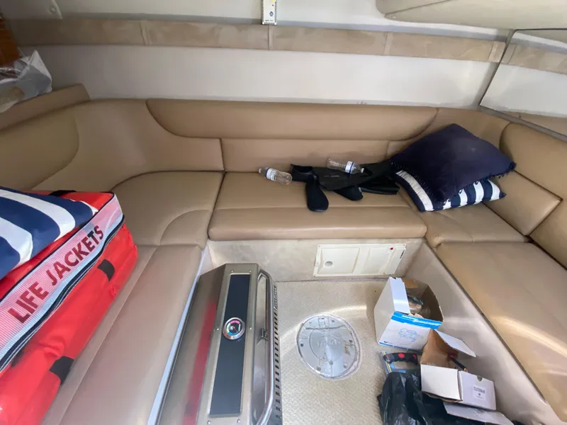 Slide: The Image of Interior of a 2006 Doral 365 boat with beige seating and life jackets. - 41