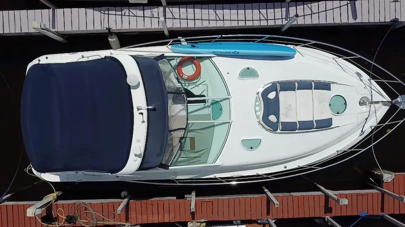 Slide: The Image of Overhead view of a 2006 Doral 365 boat docked at a marina. - 43