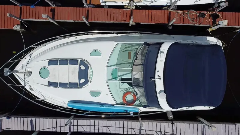 Slide: The Image of Aerial view of a 2006 Doral 365 boat docked at a marina. - 8