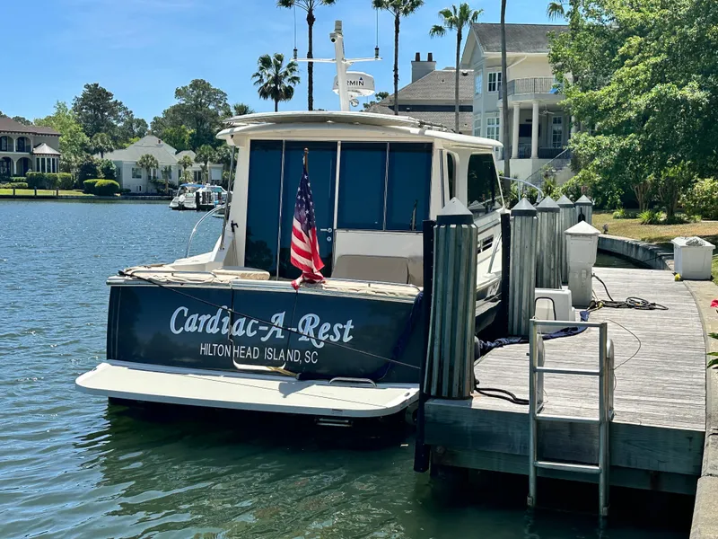 Slide: The Image of 2022 Back Cove 372 boat docked at Hilton Head Island, SC, with American flag. - 17