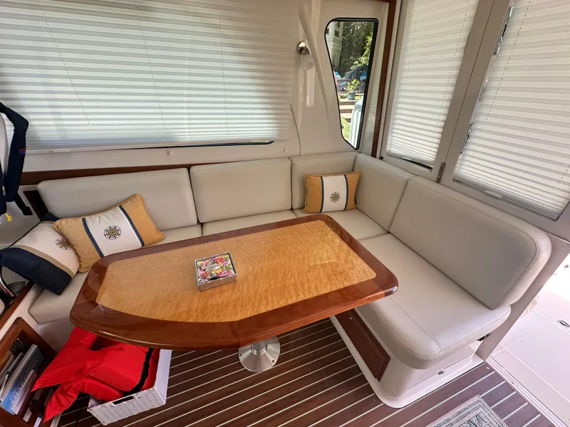 Slide: The Image of Luxurious interior of 2022 Back Cove 372 yacht with elegant seating and wooden table. - 26