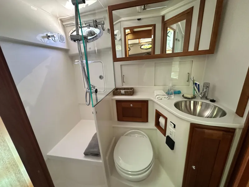 Slide: The Image of Luxurious bathroom in 2022 Back Cove 372 yacht with modern fixtures and elegant wood accents. - 34