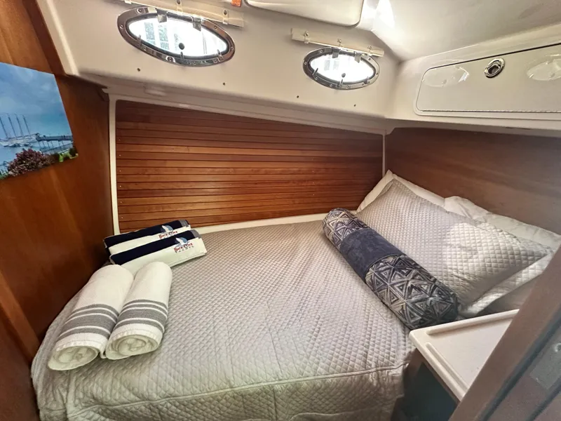 Slide: The Image of Cozy cabin interior of 2022 Back Cove 372 yacht with comfortable bedding and wooden accents. - 35