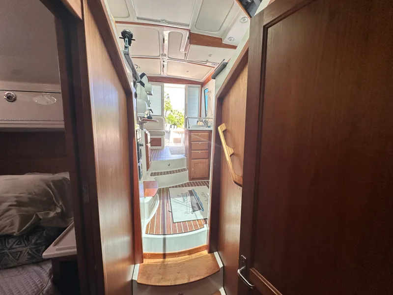 Slide: The Image of Interior view of 2022 Back Cove 372 yacht, featuring wooden cabinetry and steps. - 37