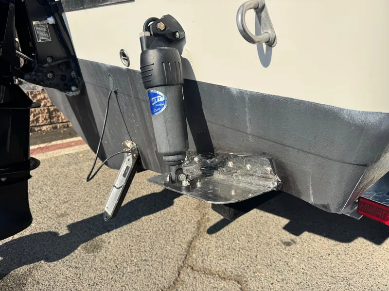 Slide: The Image of 2021 Sailfish 242 CC boat stern with trim tab and hydraulic system. - 7