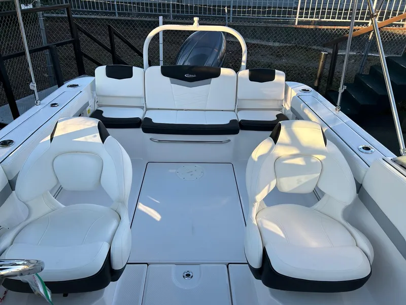 Slide: The Image of 2026 Robalo R207 Dual Console boat interior with white seating and modern design. - 26