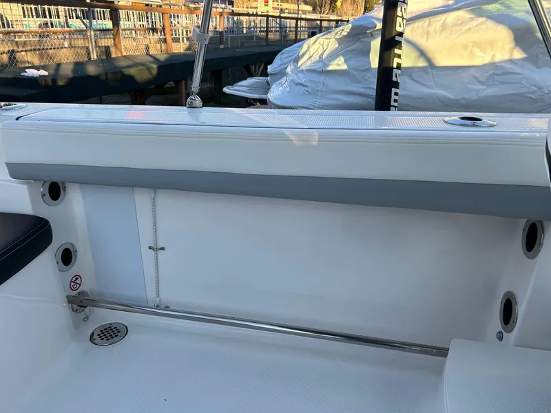 Slide: The Image of 2026 Robalo R207 Dual Console boat interior with seating and cup holders. - 29