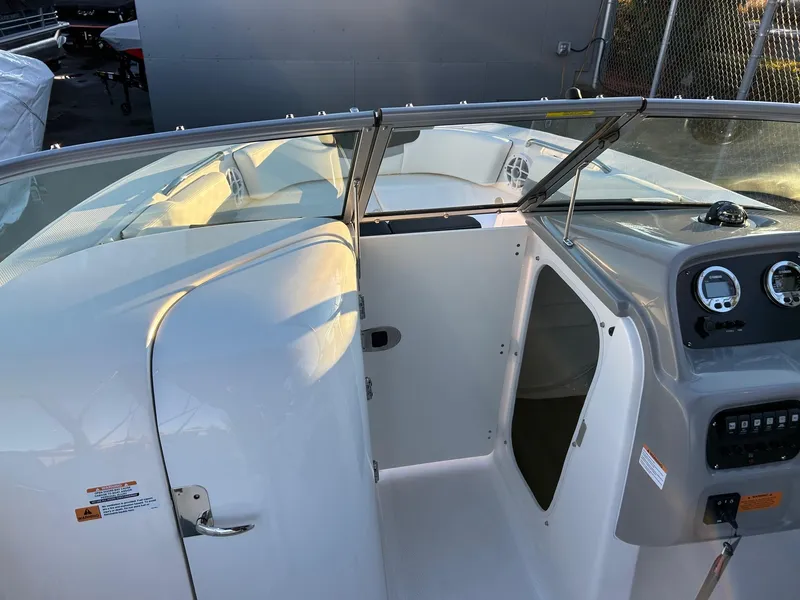 Slide: The Image of 2026 Robalo R207 Dual Console boat interior with dashboard and seating area. - 31