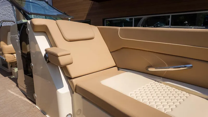Slide: The Image of 2025 Chris-Craft Launch 28 GT interior with luxurious beige seating and modern design. - 26