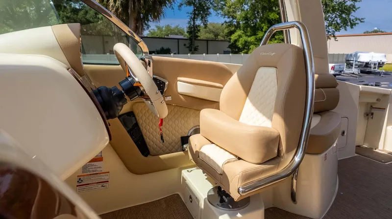 Slide: The Image of 2025 Chris-Craft Launch 28 GT interior with luxurious beige seating and steering wheel. - 31