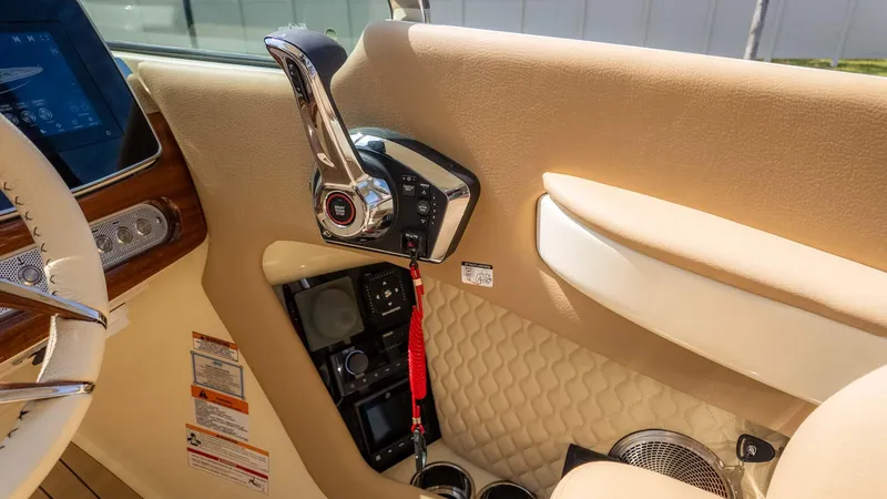 Slide: The Image of 2025 Chris-Craft Launch 28 GT interior with control panel and luxurious beige upholstery. - 35