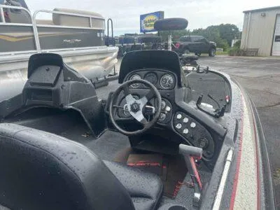 Slide: The Image of 1998 Skeeter ZX185C boat interior with steering wheel and dashboard controls. - 4