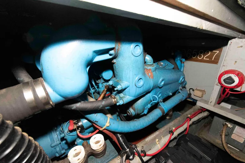 Slide: The Image of Engine compartment of 1988 Mainship 36 Double Cabin with blue machinery and wiring. - 16