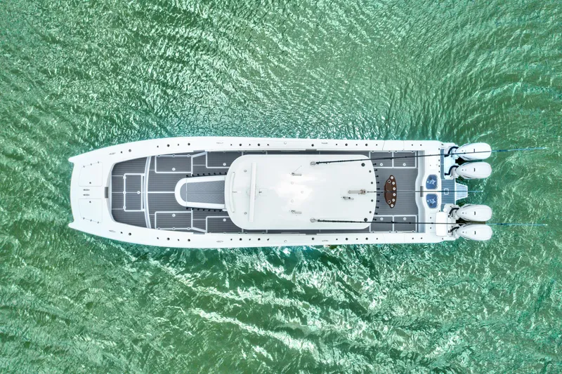 Slide: The Image of Aerial view of 2022 Freeman 47 boat on green water. - 28