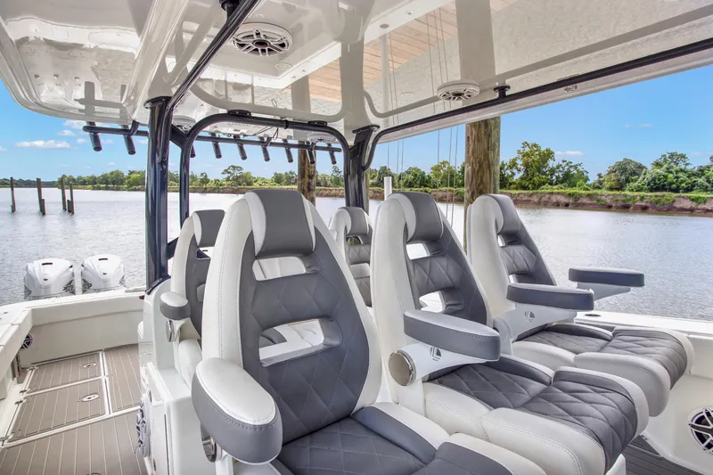 Slide: The Image of Luxurious seating on a 2022 Freeman 47 boat, featuring sleek design and waterfront view. - 31