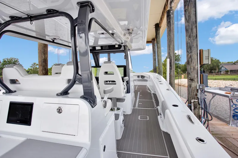 Slide: The Image of 2022 Freeman 47 boat interior with sleek design, modern seating, and advanced navigation equipment. - 33