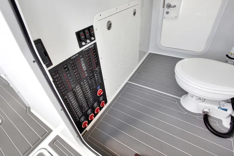 Slide: The Image of Interior of 2022 Freeman 47 boat showing control panel and marine toilet. - 40