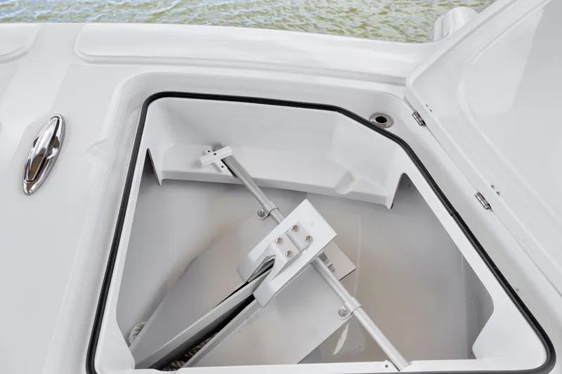 Slide: The Image of Open storage compartment on 2022 Freeman 47 boat, featuring a neatly stored anchor. - 41