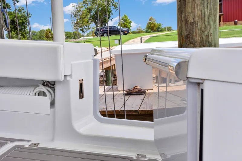 Slide: The Image of Freeman 47 boat interior, 2022 model, docked with visible deck and lush surroundings. - 44