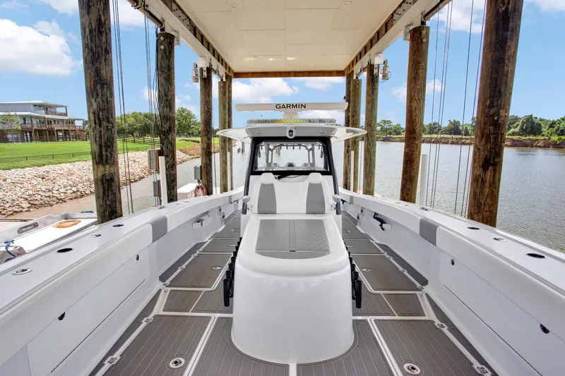 Slide: The Image of 2022 Freeman 47 boat docked, featuring spacious deck and modern design. - 46