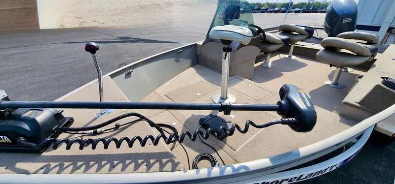 Slide: The Image of 2003 Lund 1675 Explorer SS boat interior with seating and trolling motor. - 4