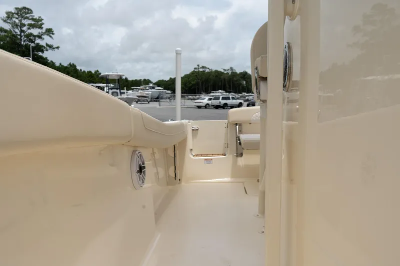 Slide: The Image of 2026 Scout 215 XSF boat interior, showcasing sleek design and spacious seating area. - 15