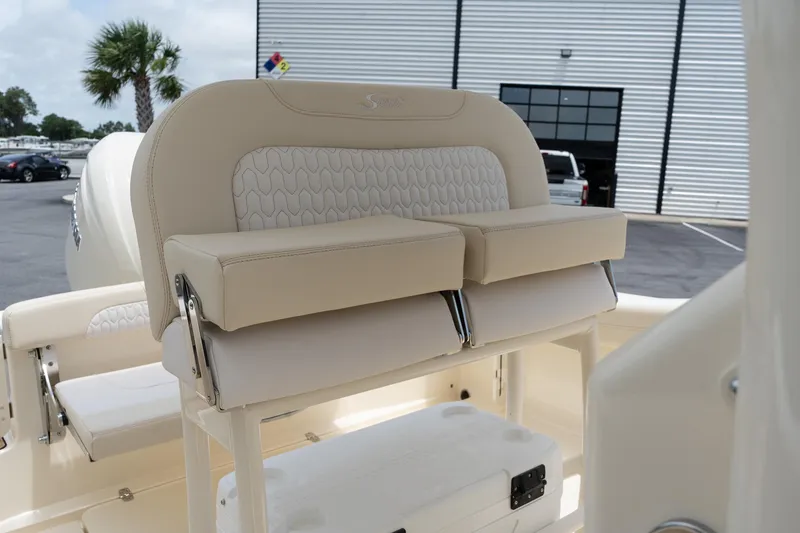 Slide: The Image of 2026 Scout 215 XSF boat seating with beige upholstery and modern design. - 17