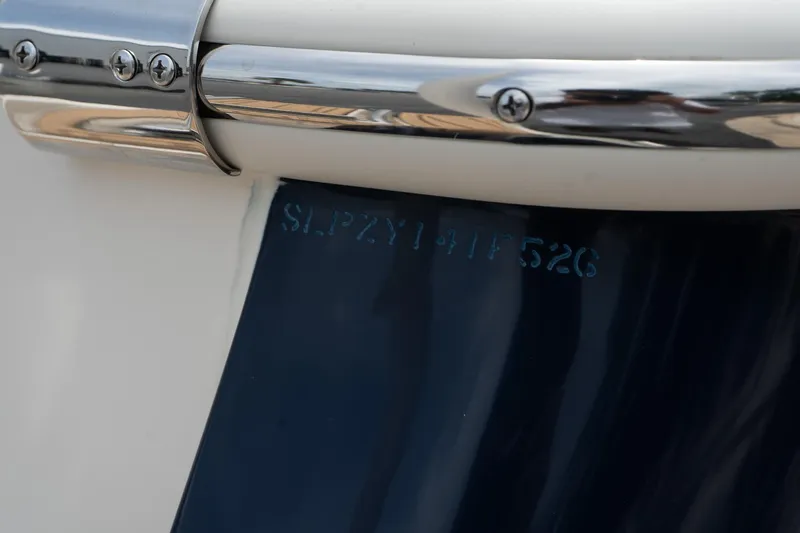 Slide: The Image of 2026 Scout 215 XSF boat detail with serial number and chrome fittings. - 18