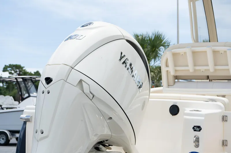Slide: The Image of 2026 Scout 215 XSF boat with Yamaha outboard motor, rear view. - 5