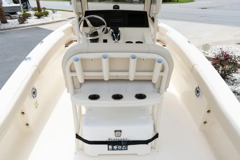 Slide: The Image of 2026 Scout 215 XSF boat interior with steering console and rod holders. - 6