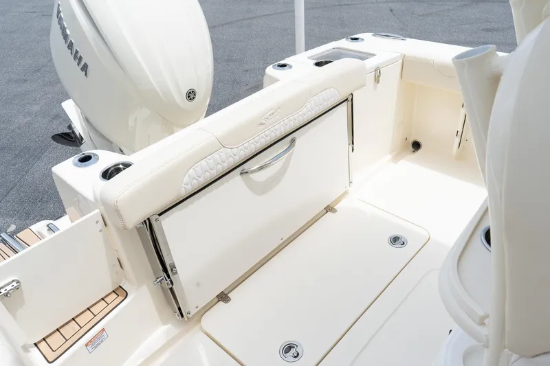 Slide: The Image of 2026 Scout 215 XSF boat interior with Yamaha engine, featuring sleek seating and storage. - 7