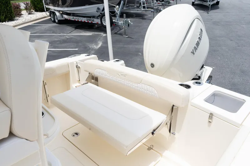 Slide: The Image of 2026 Scout 215 XSF boat interior with Yamaha engine, featuring foldable seating and sleek design. - 8