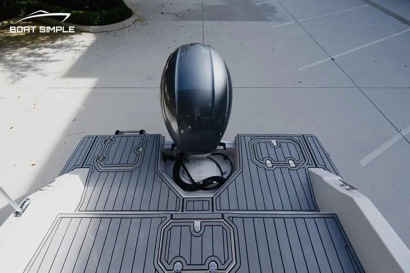 Slide: The Image of 2023 Starcraft SVX 211 OB boat with sleek outboard motor and modern deck design. - 15