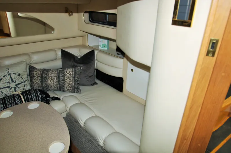 Slide: The Image of Luxurious 1997 Sea Ray 400 Sundancer cabin with plush seating and elegant decor. - 12