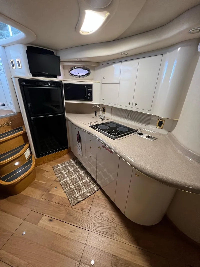 Slide: The Image of Luxurious interior of a 1997 Sea Ray 400 Sundancer yacht with plush seating and modern amenities. - 17