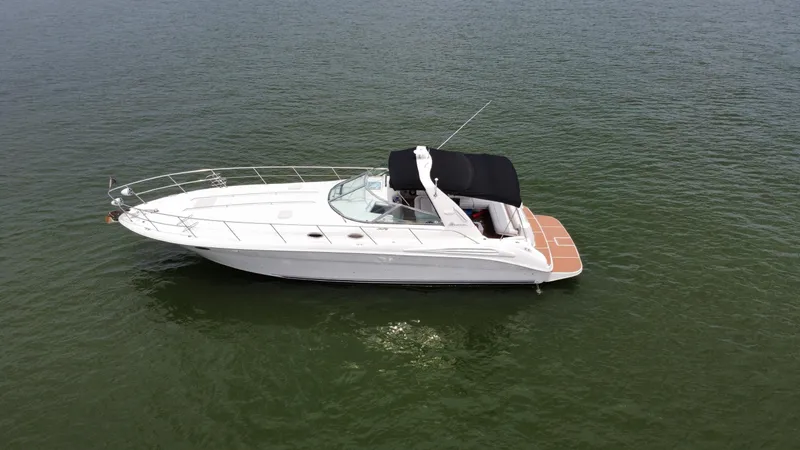 Slide: The Image of Luxurious interior of a 1997 Sea Ray 400 Sundancer yacht with plush seating and modern kitchen. - 2