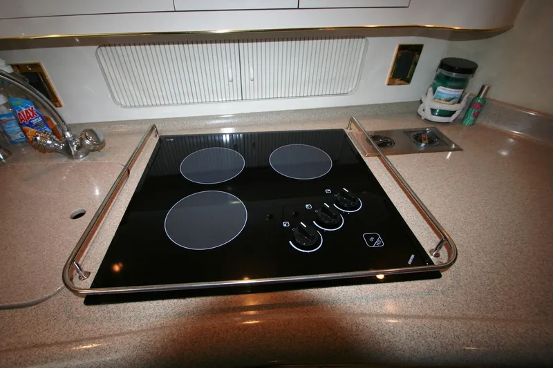 Slide: The Image of Panasonic microwave in 1997 Sea Ray 400 Sundancer yacht kitchen, with white cabinetry. - 22