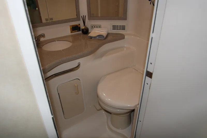Slide: The Image of Bathroom interior of 1997 Sea Ray 400 Sundancer yacht with turtle wall art. - 26