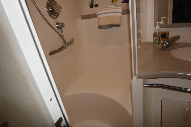 Slide: The Image of Bathroom interior of 1997 Sea Ray 400 Sundancer yacht with shower and sink. - 28
