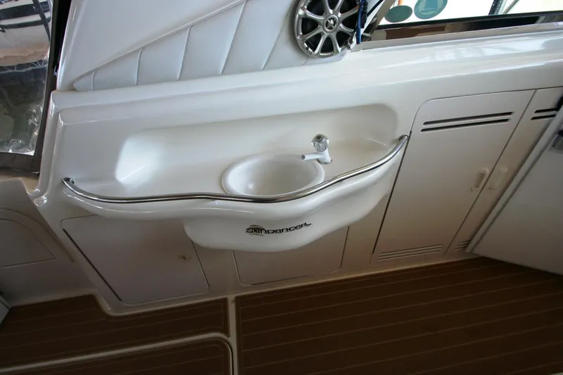 Slide: The Image of Luxurious 1997 Sea Ray 400 Sundancer interior with colorful marine-themed cushions. - 37