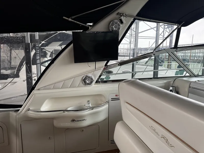 Slide: The Image of 1997 Sea Ray 400 Sundancer interior with sink and seating area. - 39